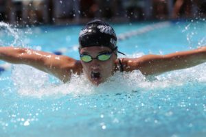 swimmer uses breathing to enhance his sporting performance