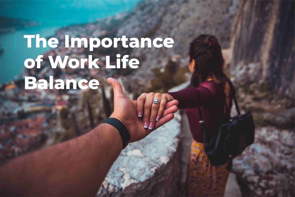 Woman holding an outstretched hand as she decends a narrow footpath leading to a coastal town. Image includes text "importance of work life balance."